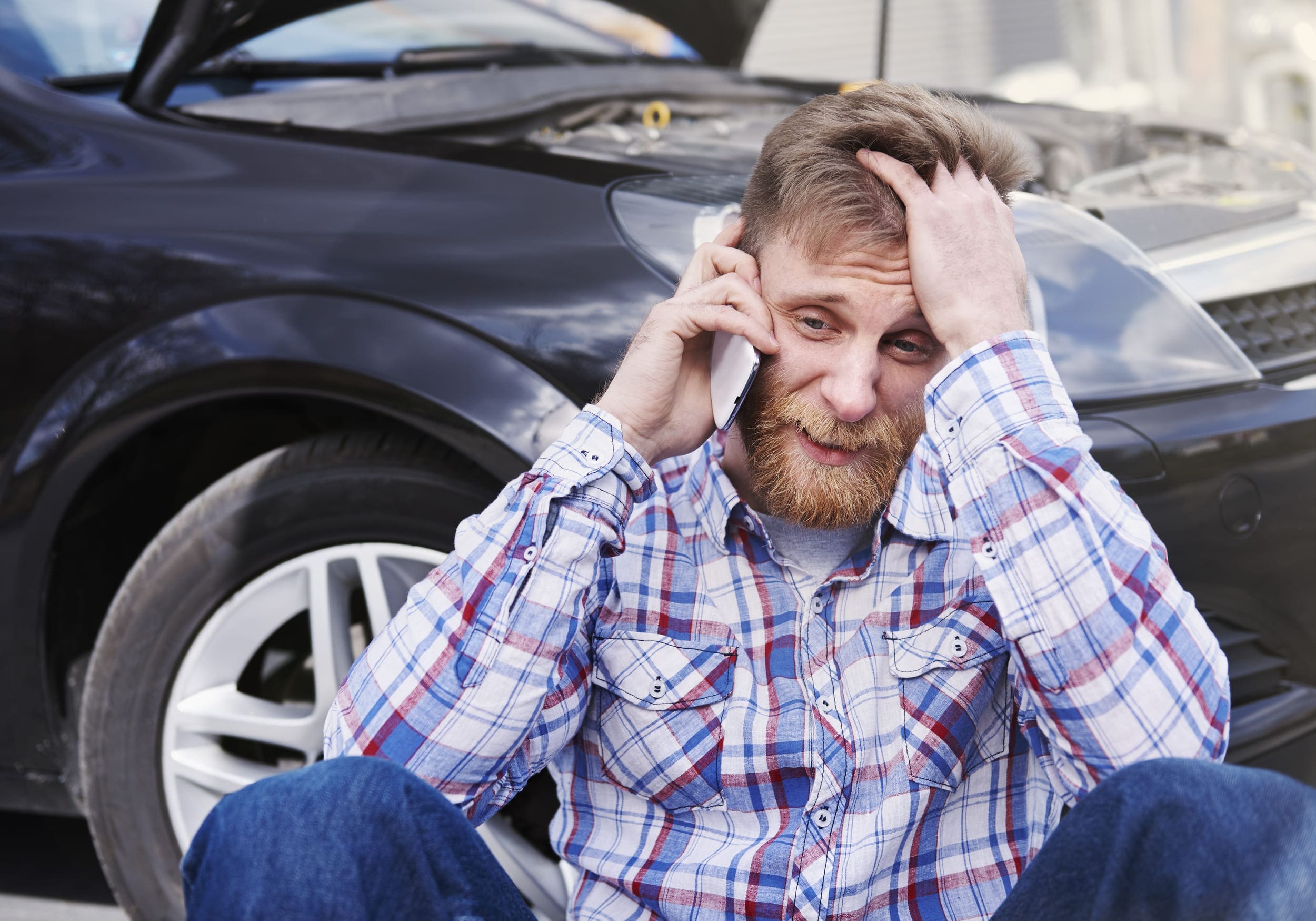 man having problem with his car